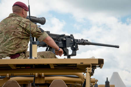 Duxford, UK - 25th May 2014: British Army machine gunner at Duxford Airshow.のeditorial素材