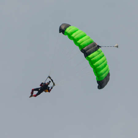 Abingdon, UK - May 4th 2014: A member of The Tigers freefall parachute team manoevering at Abingdon Airshow 2014のeditorial素材