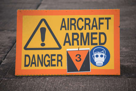 Sign warning that a fighter aircraft is armedの写真素材