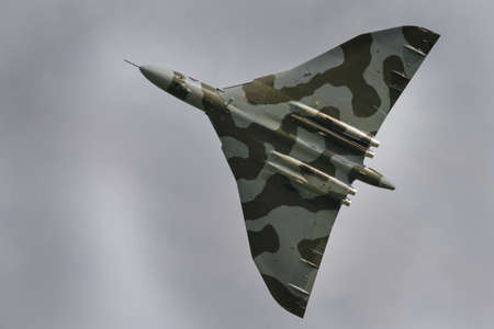 Cosford, UK - 8 June 2014: Vintage British restored Vulcan Bomber XH558, displaying at the RAF Cosford Airshow.のeditorial素材