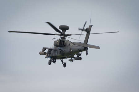 Cosford, UK - 8 June 2014: A British Army Apache helicopter, displaying at the RAF Cosford Airshow.
