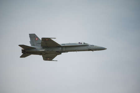 Fairford, UK - 12 July 2014: Swiss Airforce F18 Hornet fighter aircraft in flight and displaying at...