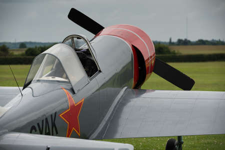Biggleswade, UK - 29 June 2014: A vintage  YAK 52 belonging to the Aerostars team at the Shuttleworth Collection air show.のeditorial素材