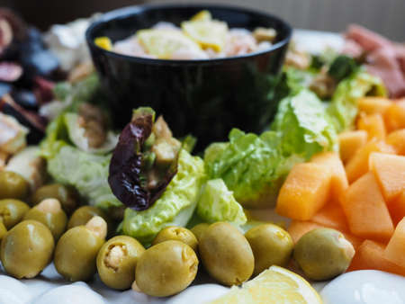 Delicious healthy salad on plate, with Olivesの写真素材