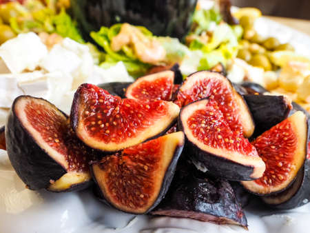 Delicious ripe  figs in fruit salad, ready to serve.の写真素材