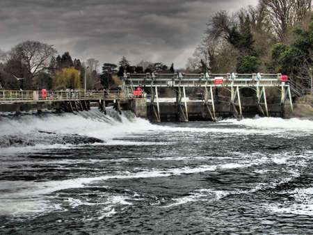 Maidenhead, UK - 23rd March 2015: Boulters Lock weir in spate.のeditorial素材