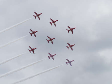 Yeovilton, UK - 11th July 2015: Red Arrows air display team flying at Yeovilton Air Day.のeditorial素材