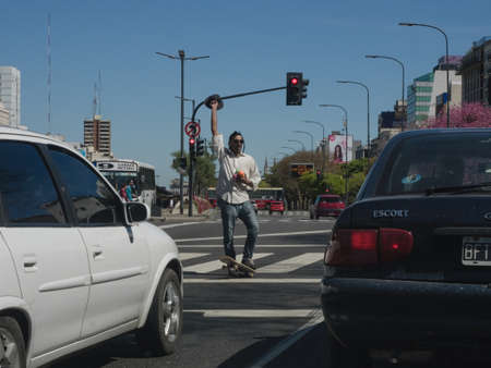 Buenos Aires, Argentina - 18th October 2015: A juggling street performer at traffic lights.のeditorial素材