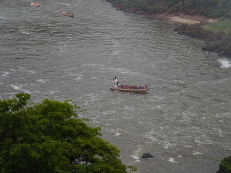 Tourist boats at the Iguazu waterfall in Argentina prior to trip under the fallsのeditorial素材