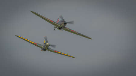 Biggleswade, UK - 7th May 2017: Pair of vintage British   Hurricane fighters in flightのeditorial素材