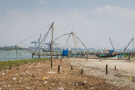 Fort Kochi, India - 16th November 2017: A view of the famous chinese stationary fishing nets on the shore side within the historic old town of Kochi, Kerala, India.のeditorial素材