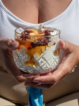 Fruit sundae held by womanの写真素材