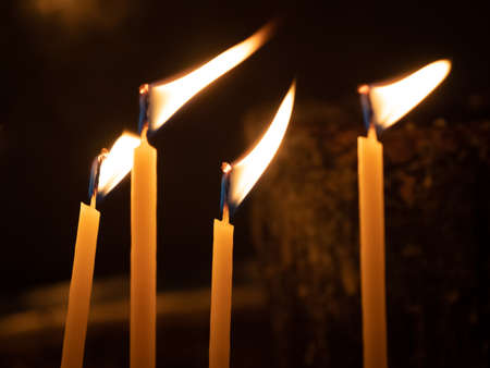 Votive candles alight in Greek Orthodox Churchの写真素材