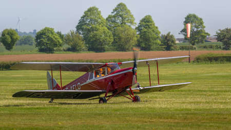Biggleswade, UK - 6th May 2018: A beautiful vintage de Havilland DH.87 Hornet Moth landing at...