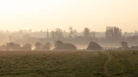 A misty morning in rural england countryside with no people seen