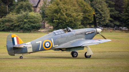 Old Warden, UK - 4th August 2019: A vintage WW2 Hawker Hurricane landing at airfieldのeditorial素材