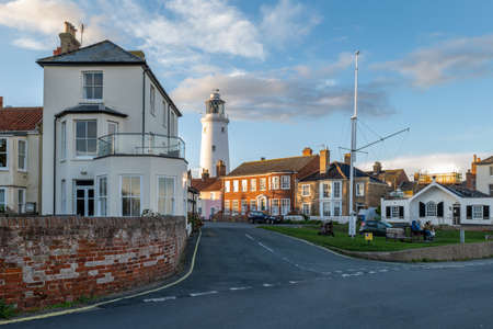 Southwold,UK - 26th October 2020: A view of Southwold, Suffolk UK inshore lighthouse at sunset on a cold autumn evening, looking towards Sizewell Power Stationのeditorial素材