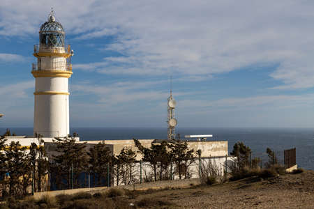 The Cabo Sacratif lighthouse on the coast of Andalusia near Motril in southern Spainの写真素材