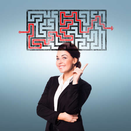 businesswoman thinking about the solution to a maze の写真素材