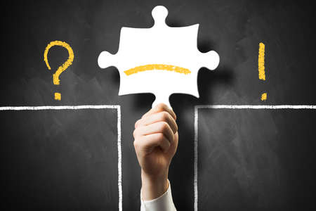 man holding a puzzle piece as a bridge over the gap between problem and solution