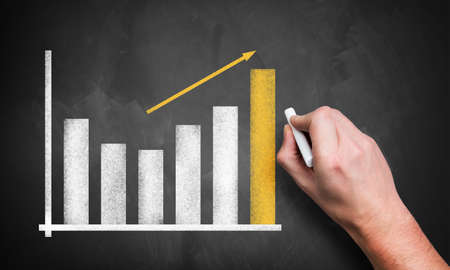 hand drawing a business chart 