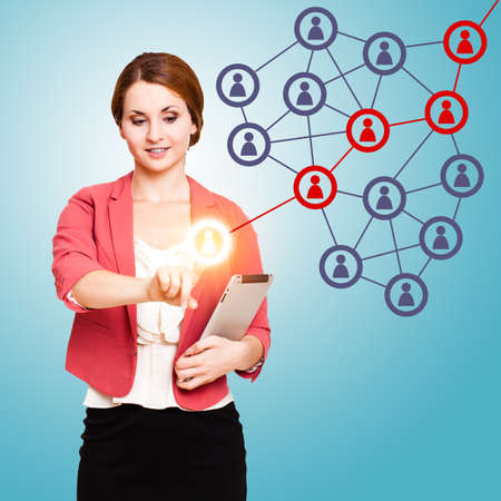 young woman touching an icon activating a word of mouth chainの写真素材