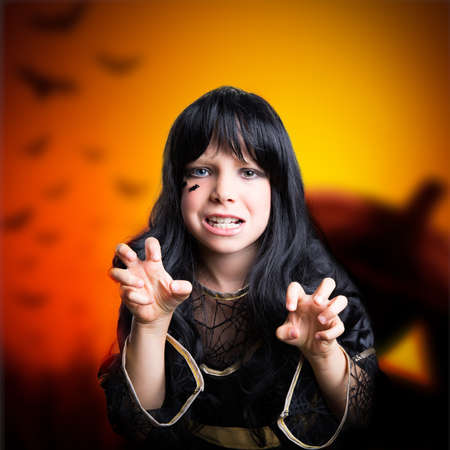 young girl dresses as a witch 