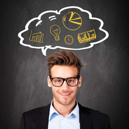 attractive young businessman with many ideas の写真素材