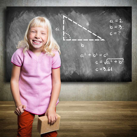 young girl solving a math problem の写真素材