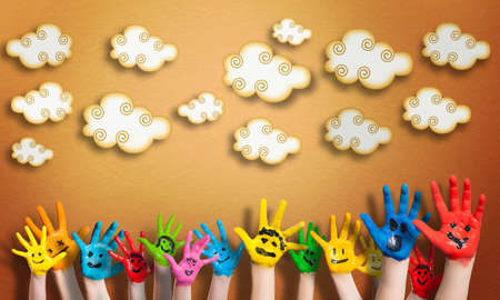 many painted children hands with smileys の写真素材