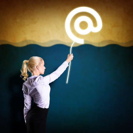 businesswoman catching an e-mail の写真素材