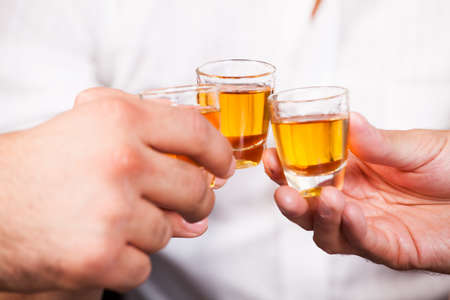 three people with rum shots 
