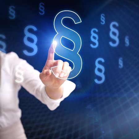 a woman is pressing a virtual paragraph symbolの写真素材