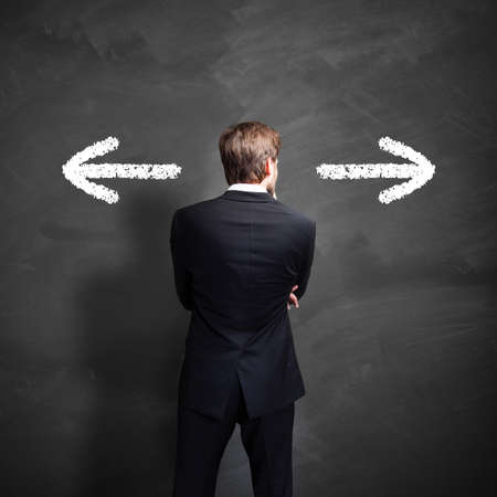 businessman has to decide which way to goの写真素材