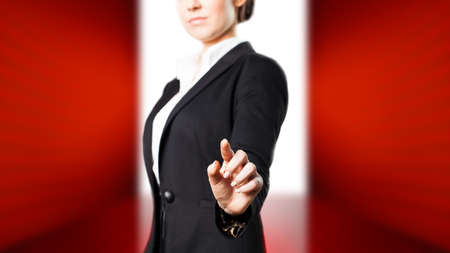 attractive businesswoman touching a virtual screenの写真素材
