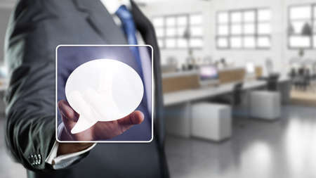 businessman selecting chat symbolの写真素材