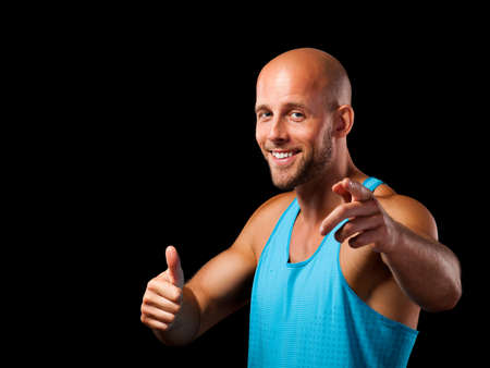 sporty man with thumb up gestureの写真素材