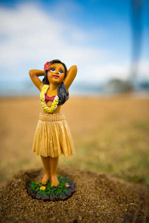 little hula dancer figure at the beachの写真素材