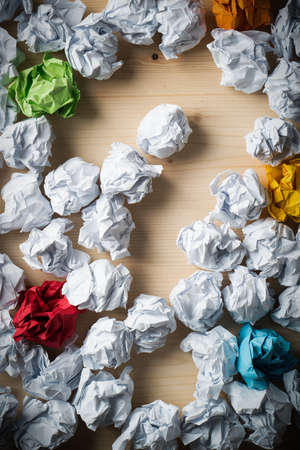 crumpled paper symbolizing different solutions with a big question-markの写真素材