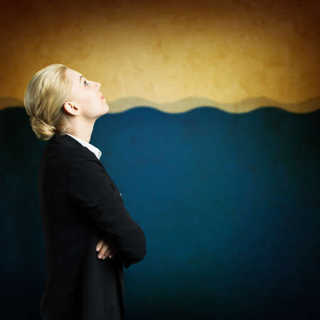 attractive businesswoman looking upの写真素材