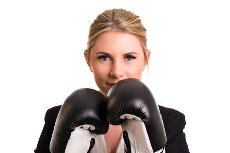 attractive businesswoman with boxing gloves isolated on whiteの写真素材