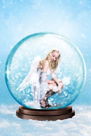 blonde angel trapped in a snowglobeの写真素材