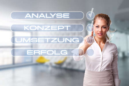 young businesswoman following a checklistの写真素材