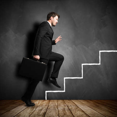 businessman running the symbolic career stairs