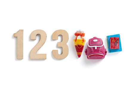 wooden numbers 123 and little figures symbolizing first days of school on white background