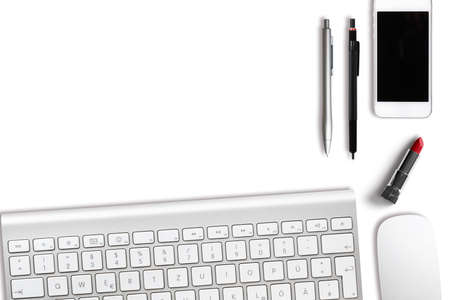 modern computer workplace with keyboard and other office utensils isolated on white