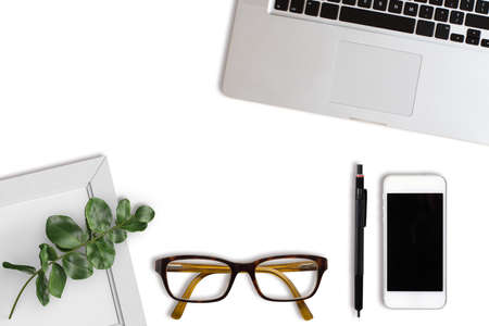 modern computer workplace with keyboard and other office utensils isolated on whiteの写真素材