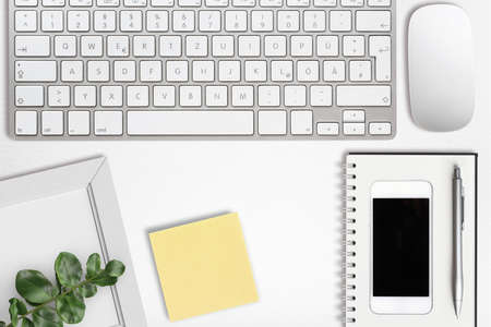 modern computer workplace with keyboard and other office utensils