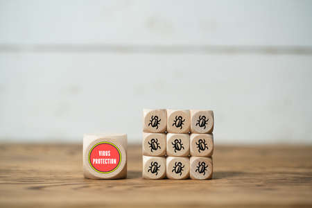 cube with the word "virus protection" on wooden backgroundの写真素材