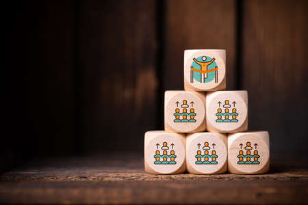 election process shown as symbols on cubes on wooden background